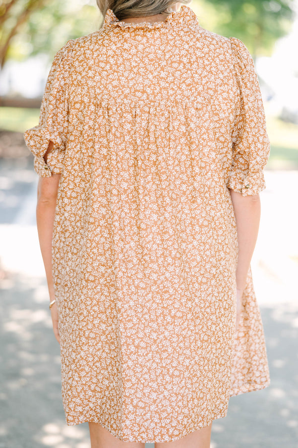 Plus Size brown floral mini dress with a V-neckline, short puff sleeves, and a relaxed babydoll fit.