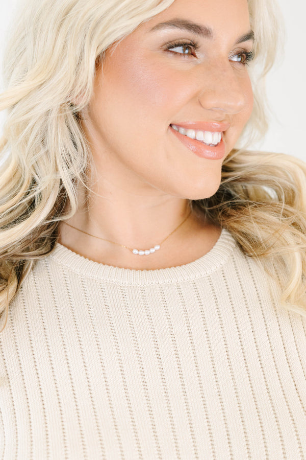 Gold necklace adorned with five dainty pearls with lobster clasp and extender