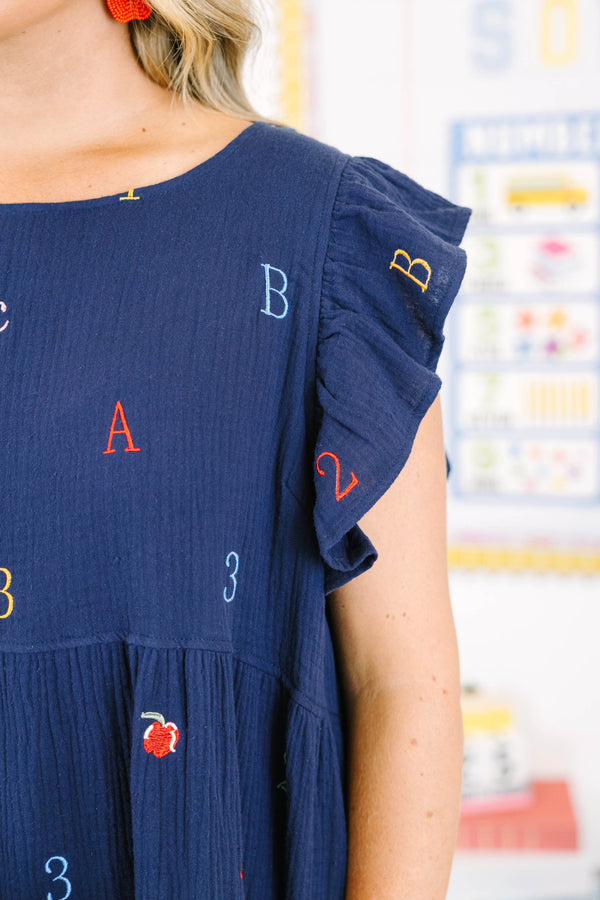 Plus Size navy babydoll dress with flutter sleeves and colorful embroidered letters and numbers.