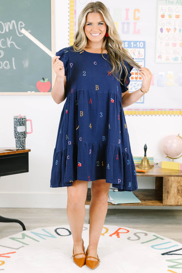 Plus Size navy babydoll dress with flutter sleeves and colorful embroidered letters and numbers.