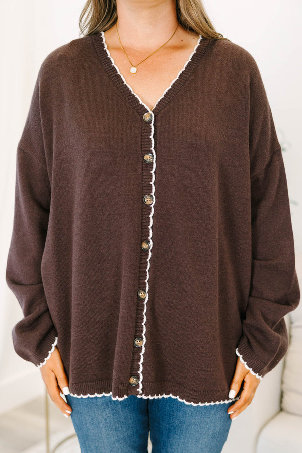 Plus Size brown oversized knit cardigan with white scalloped trim, V-neckline, and button front.