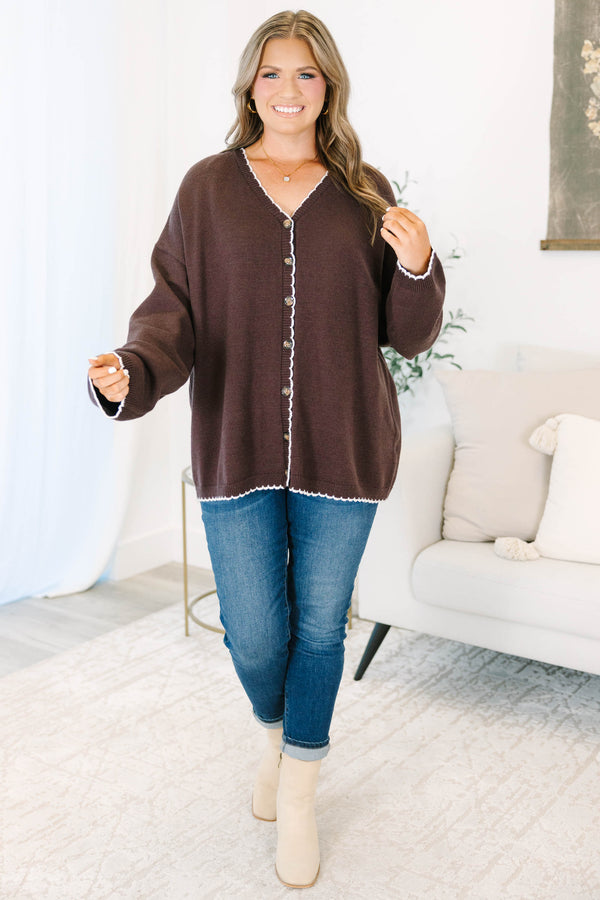 Plus Size brown oversized knit cardigan with white scalloped trim, V-neckline, and button front.