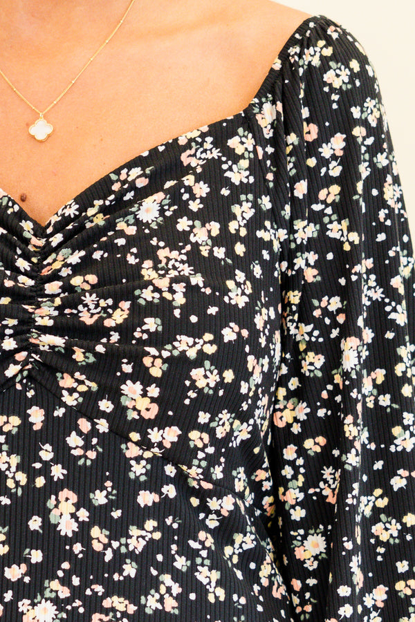 quarter-bubble-sleeve black dress with sweetheart-neckline and multi-colored subtle floral pattern detailing