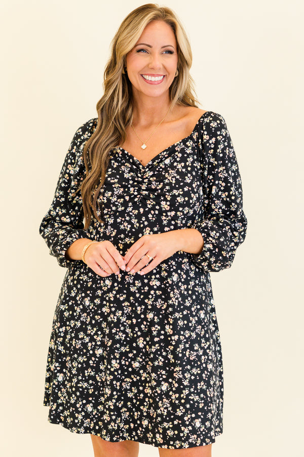 quarter-bubble-sleeve black dress with sweetheart-neckline and multi-colored subtle floral pattern detailing