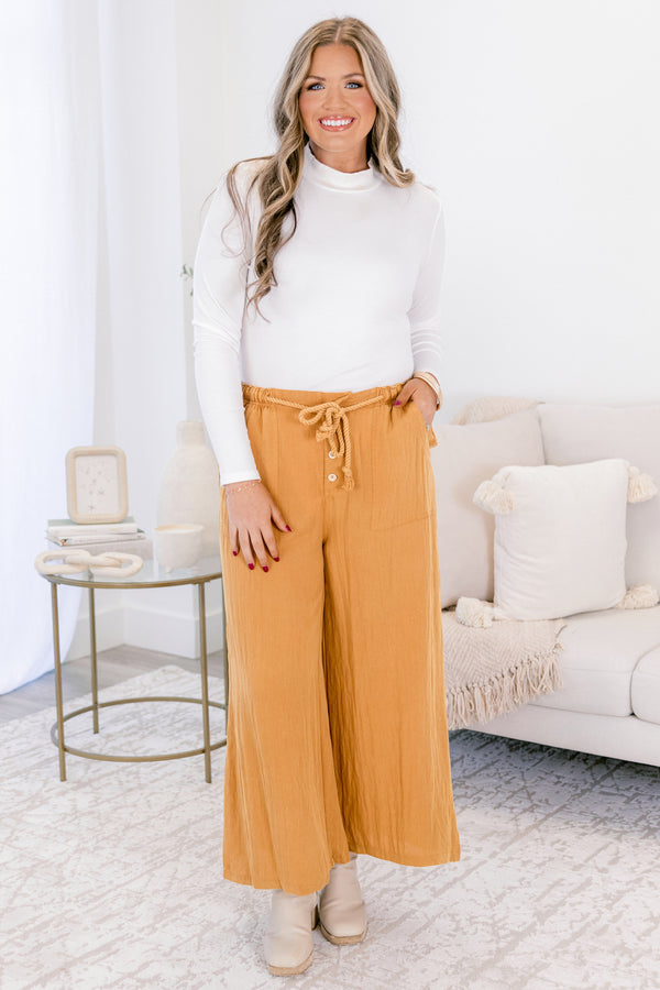 Chic Soul plus size clothing, ochre yellow flowy wide pants with shoelace tie around waist and three button fly