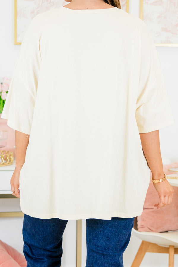 Chic Soul plus size clothing, short-sleeve ivory boyfriend tee with high-scoop-neckline and graphic art of a smiley face with pink leopard print pattern outlined with black sparkles