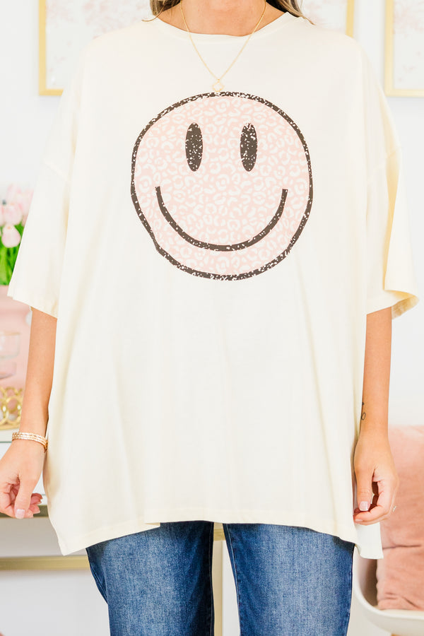Chic Soul plus size clothing, short-sleeve ivory boyfriend tee with high-scoop-neckline and graphic art of a smiley face with pink leopard print pattern outlined with black sparkles