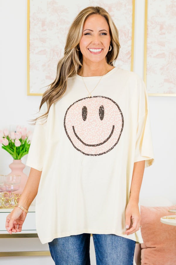 Chic Soul plus size clothing, short-sleeve ivory boyfriend tee with high-scoop-neckline and graphic art of a smiley face with pink leopard print pattern outlined with black sparkles