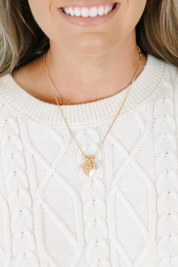 Plus Size gold chain necklace with a heart-shaped pendant and small clear stone charm.