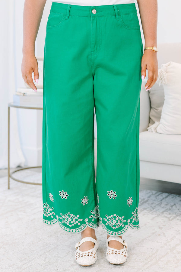 Plus Size green wide-leg jeans with a high-rise waist and white floral eyelet scalloped hems.
