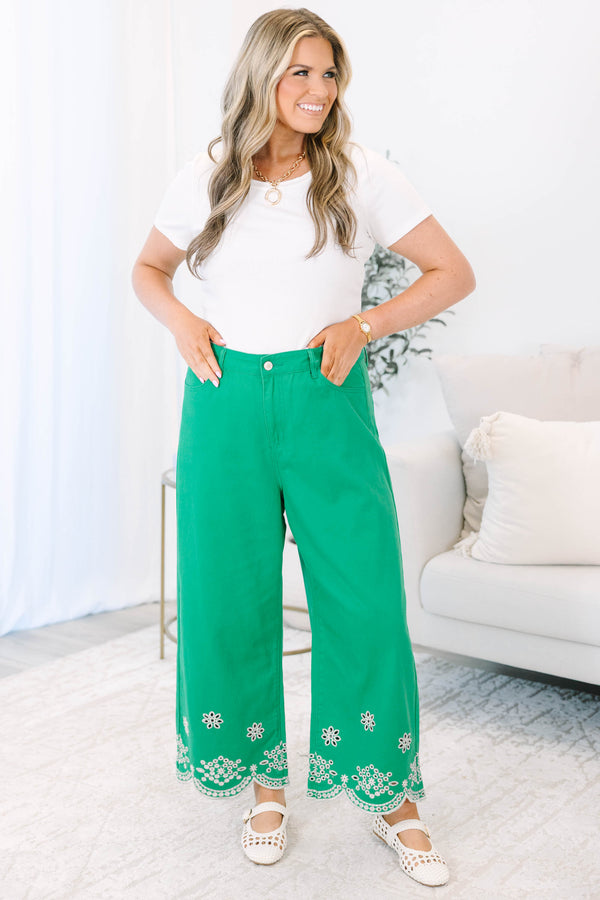 Plus Size green wide-leg jeans with a high-rise waist and white floral eyelet scalloped hems.