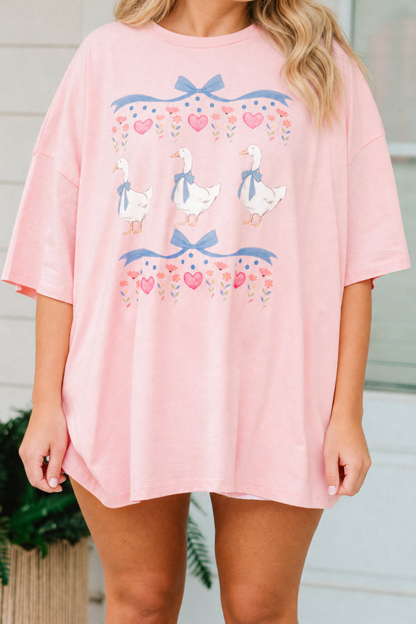 Plus Size dusty pink oversized boyfriend tee with a vintage coquette geese and bow graphic.