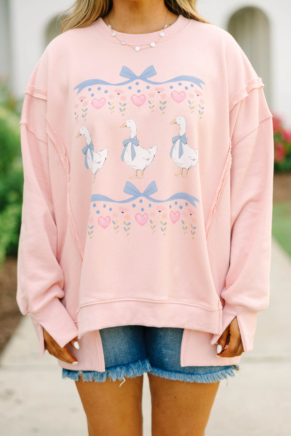 Plus Size dusty pink oversized crewneck sweatshirt with a graphic of three geese and blue bows.