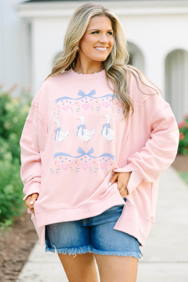 Plus Size dusty pink oversized crewneck sweatshirt with a graphic of three geese and blue bows.