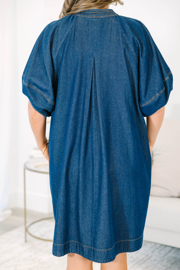 Plus Size dark denim dress with a V-neckline, decorative stitching, and short puff sleeves.