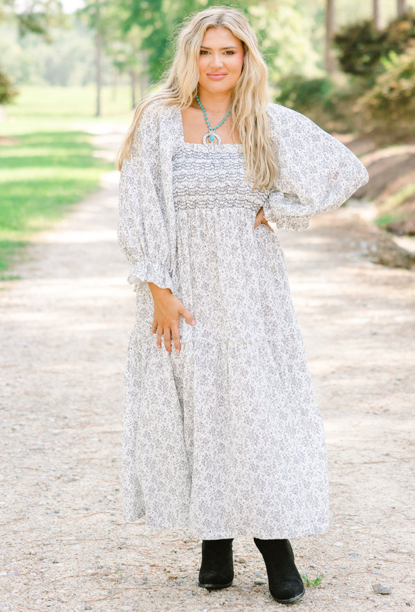 Chic Soul plus size clothing, white maxi dress with a dainty black floral pattern and long sleeves that have a small ruffle detail at the end of the sleeves as well as a square neckline  