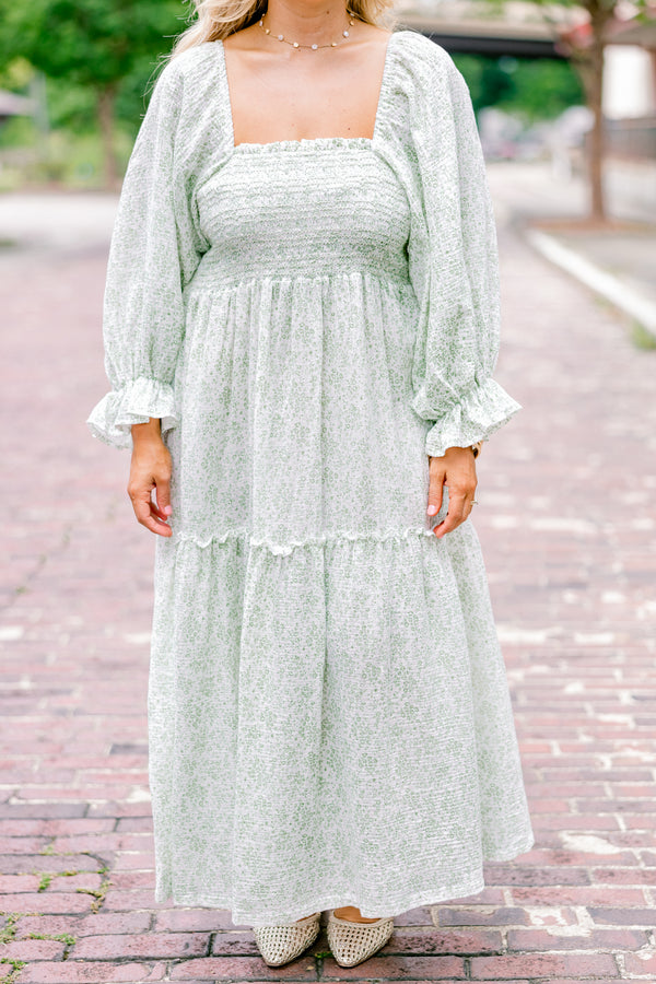 Chic Soul Plus size clothing, cream maxi dress with long sleeves that have a ruffle detail on the ends and a floral pattern throughout 