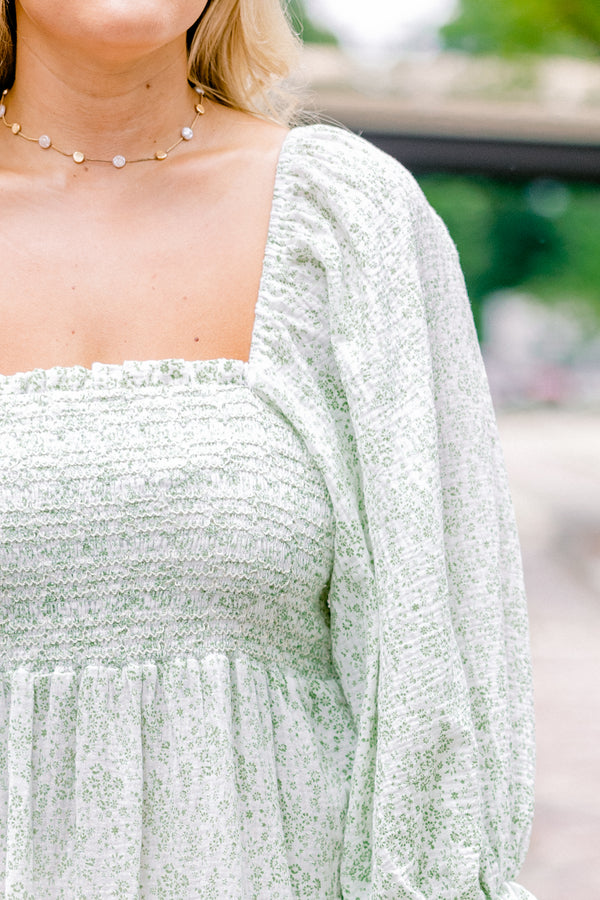 Chic Soul Plus size clothing, cream maxi dress with long sleeves that have a ruffle detail on the ends and a floral pattern throughout 