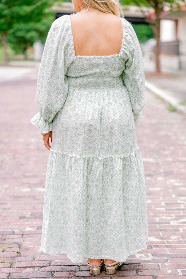 Chic Soul Plus size clothing, cream maxi dress with long sleeves that have a ruffle detail on the ends and a floral pattern throughout 