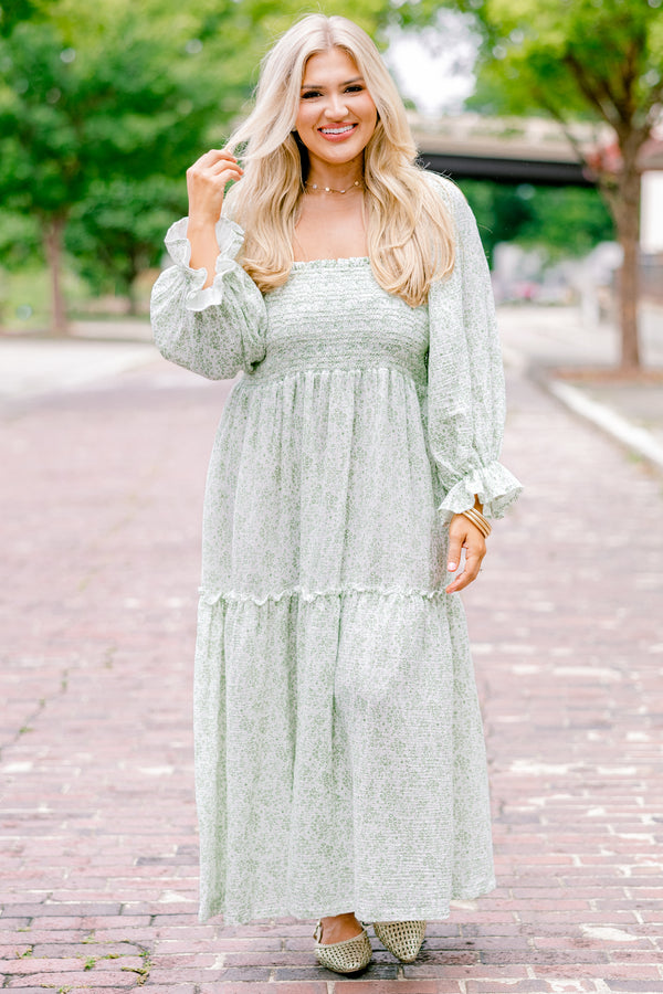 Chic Soul Plus size clothing, cream maxi dress with long sleeves that have a ruffle detail on the ends and a floral pattern throughout 