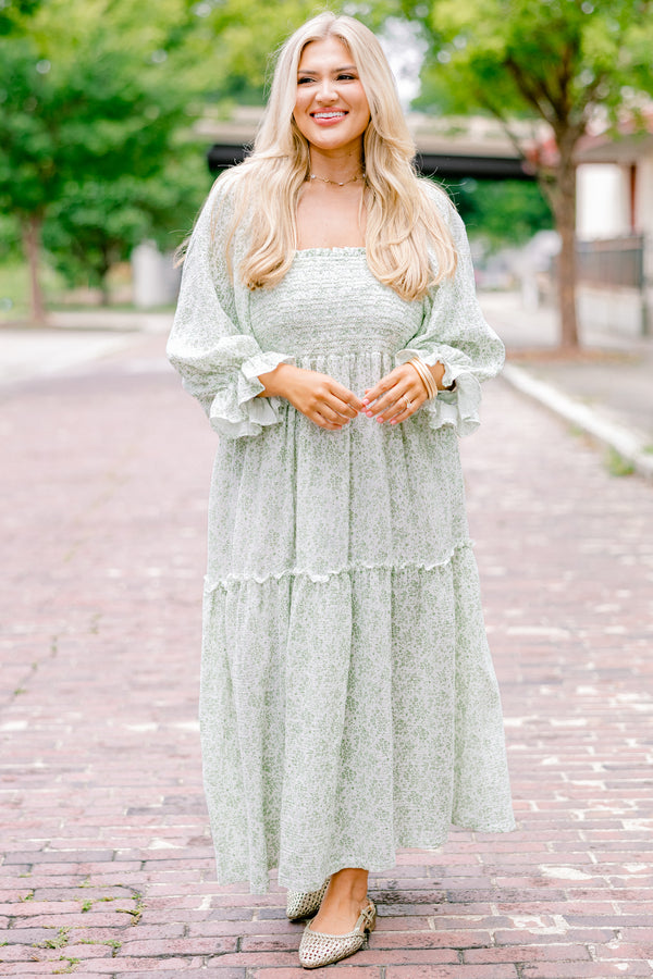 Chic Soul Plus size clothing, cream maxi dress with long sleeves that have a ruffle detail on the ends and a floral pattern throughout 