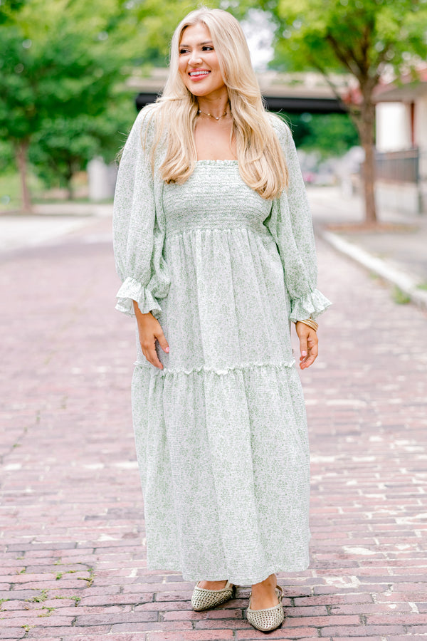 Chic Soul Plus size clothing, cream maxi dress with long sleeves that have a ruffle detail on the ends and a floral pattern throughout 