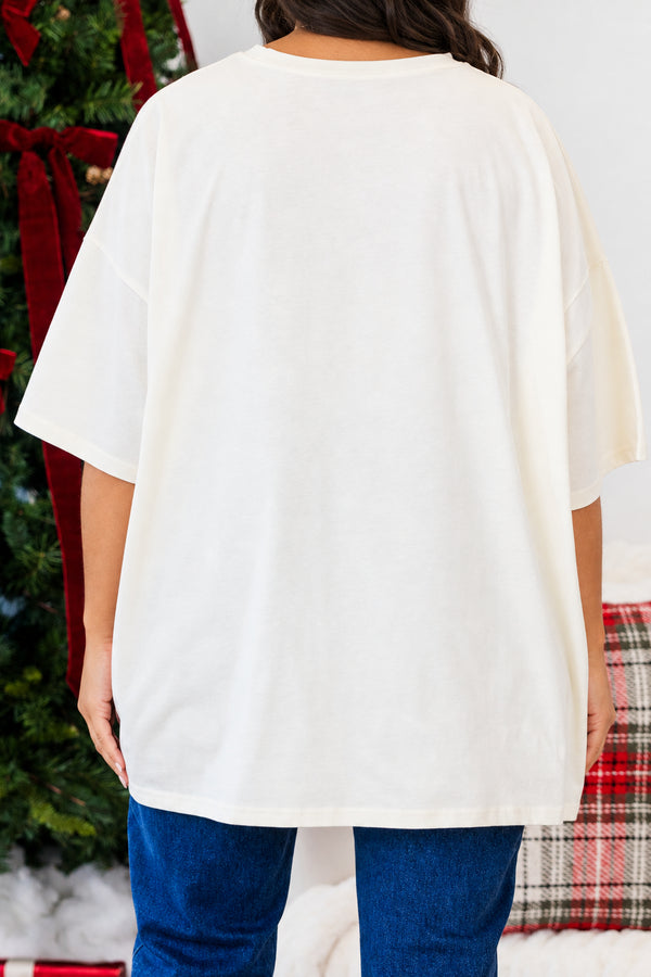 Chic Soul plus size clothing. Oversized ivory boyfriend tee featuring a festive Christmas tree graphic with a green floral pattern and a large red patterned bow.