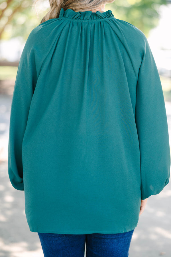 Plus Size forest green long sleeve top with a ruffled neckline and button-down front.