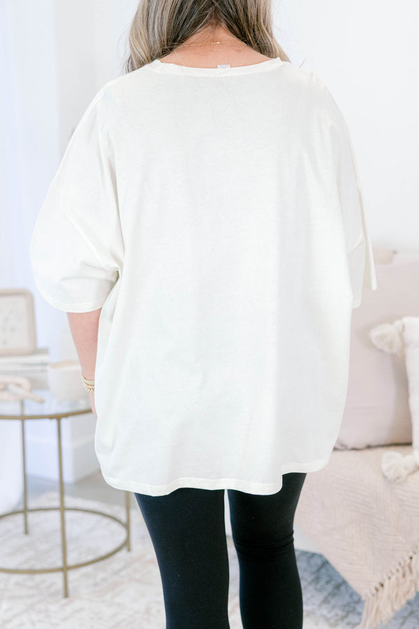 Chic Soul plus size clothing, ivory, oversized, short sleeve t-shirt with multi colored smile face graphics on the front 