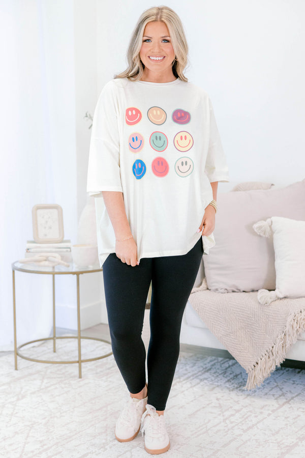 Chic Soul plus size clothing, ivory, oversized, short sleeve t-shirt with multi colored smile face graphics on the front 
