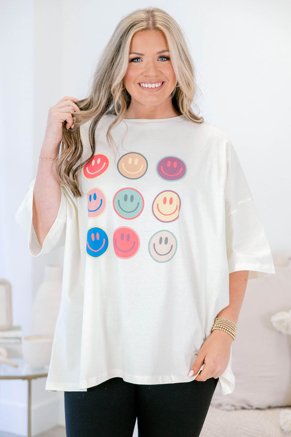 Chic Soul plus size clothing, ivory, oversized, short sleeve t-shirt with multi colored smile face graphics on the front 