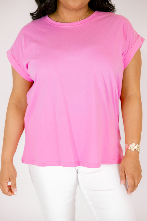 candy pink tee with cuffed short sleeves and a round neckline