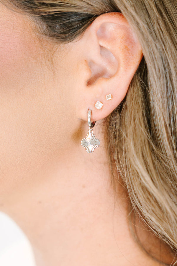 Plus Size silver hoop earrings with a textured four-leaf clover charm and small square studs.