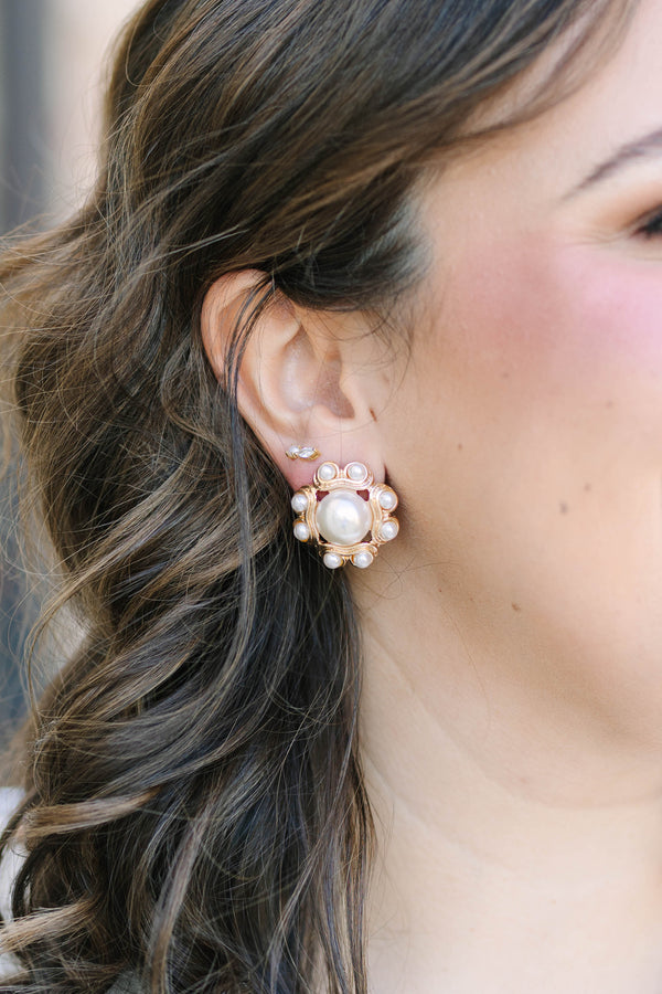 Plus Size gold floral stud earrings featuring a large central pearl and smaller pearl accents.