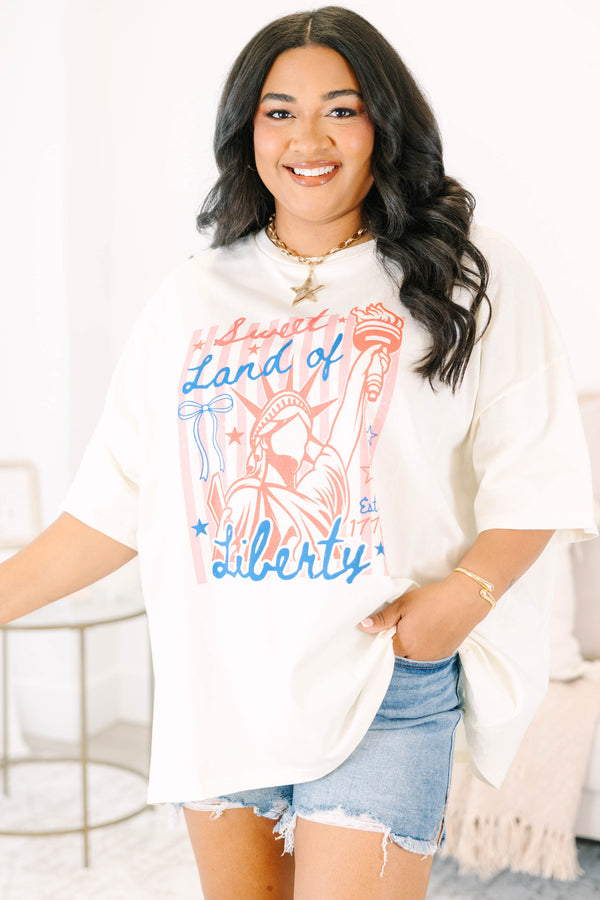 Plus Size ivory oversized boyfriend tee with a red and blue Statue of Liberty graphic.