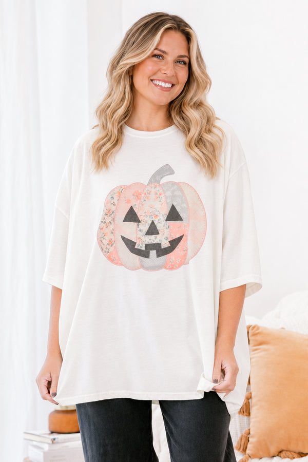 Chic Soul plus size clothing, Ivory short sleeve graphic tee with a jack-O-lantern on the center of the shirt that is filled with various patterns 