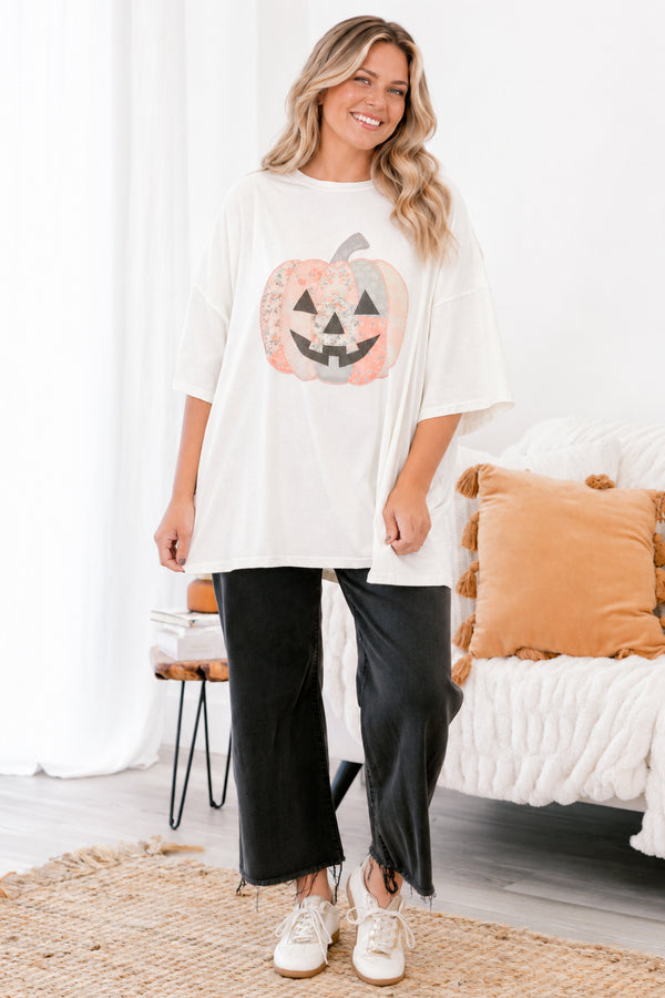 Chic Soul plus size clothing, Ivory short sleeve graphic tee with a jack-O-lantern on the center of the shirt that is filled with various patterns 
