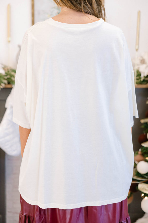 Chic Soul plus size clothing, off white oversized tee with a red and green patchwork style bow image on it