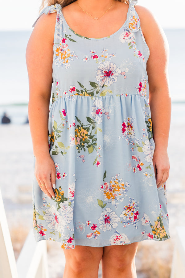 Chic Soul plus size clothing, blue sleeveless mini dress with floral design with tie straps and round neckline with pockets