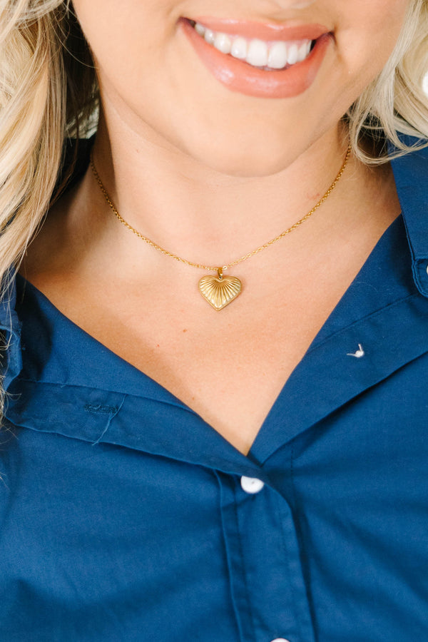 Plus Size gold necklace with a delicate chain and a textured ridge heart pendant.