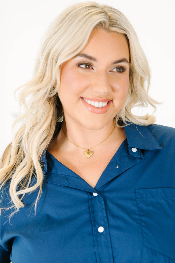 Plus Size gold necklace with a delicate chain and a textured ridge heart pendant.
