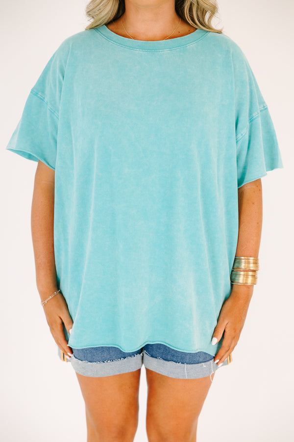 Plus size woman in a Relax and Repeat Turquoise Tee with an oversized, flowy fit and mineral wash.