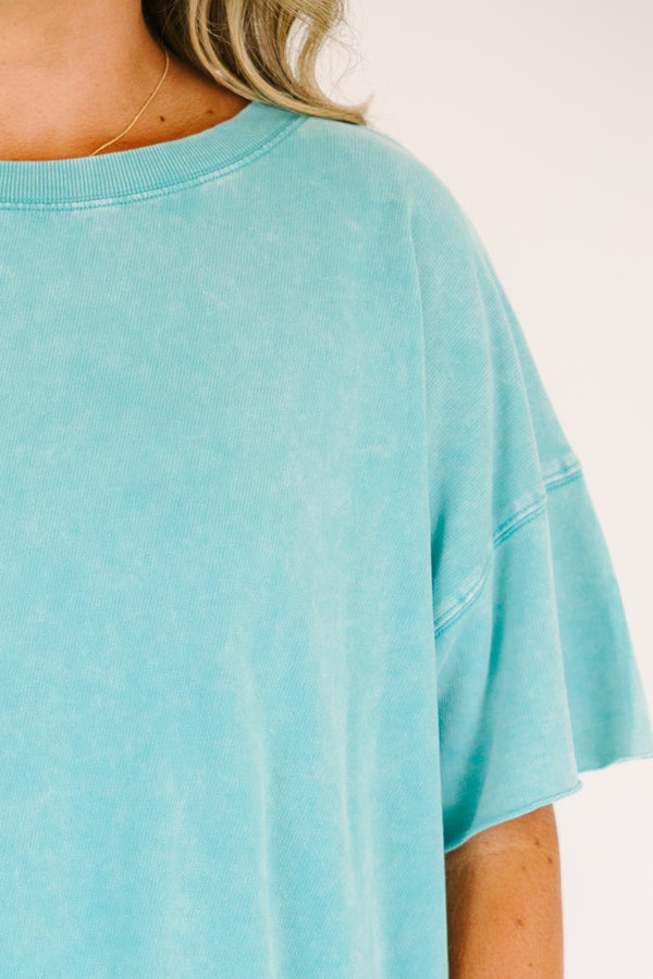 Plus size woman in a Relax and Repeat Turquoise Tee with an oversized, flowy fit and mineral wash.