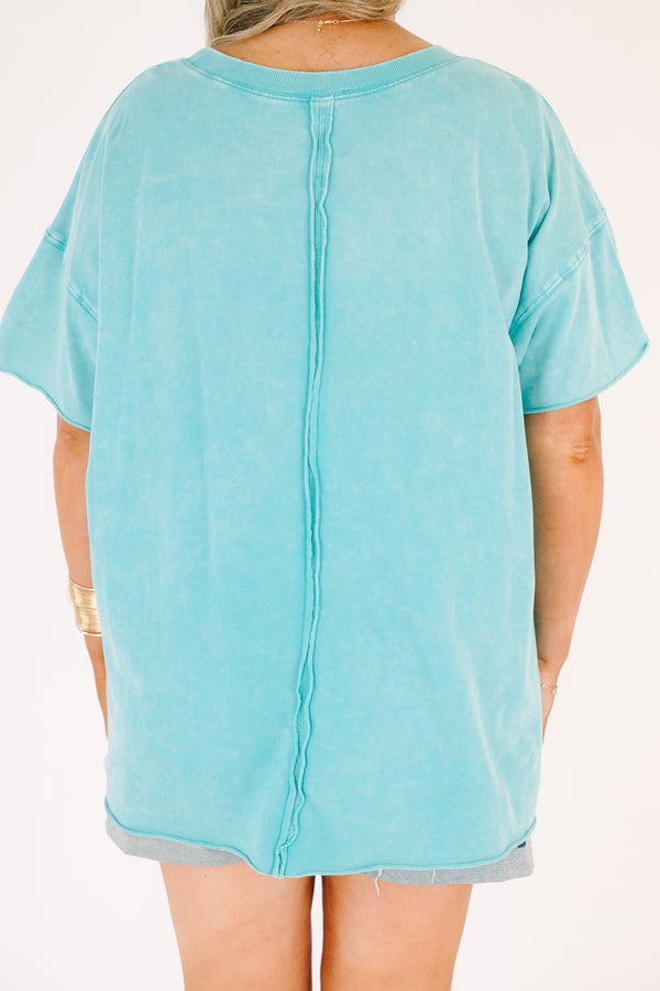 Plus size woman in a Relax and Repeat Turquoise Tee with an oversized, flowy fit and mineral wash.