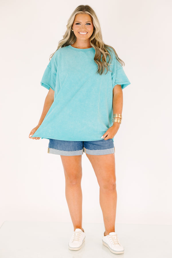 Plus size woman in a Relax and Repeat Turquoise Tee with an oversized, flowy fit and mineral wash.