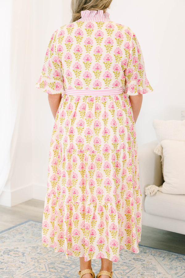 Plus size pink floral midi dress with a ruffle collar, striped waist tie, and flowy tiered skirt.