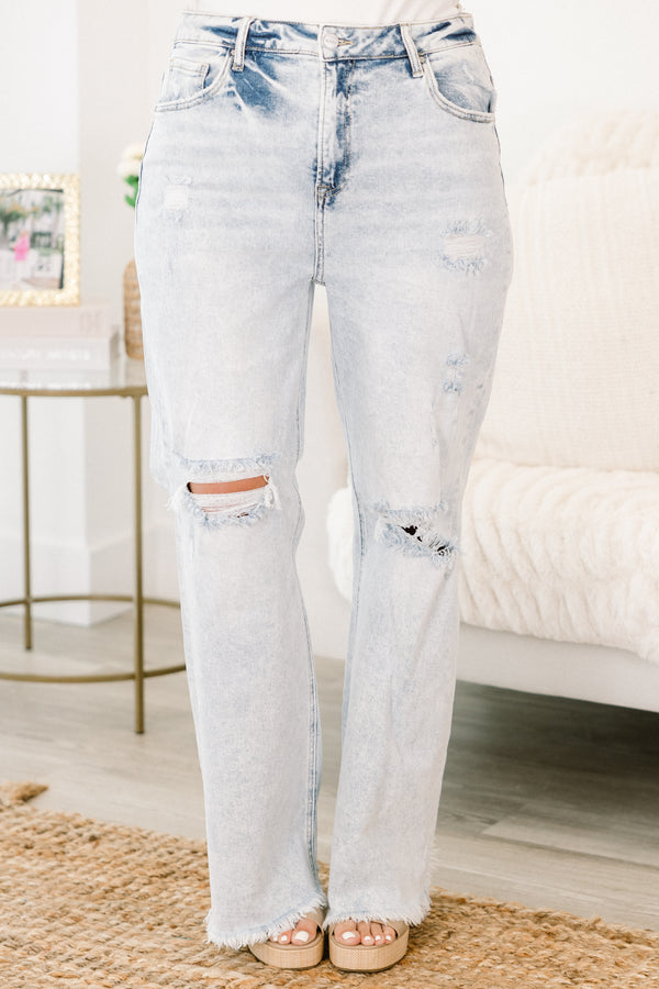 Chic Soul plus size clothing, light wash blue denim jeans with rips at the knees and frayed edges