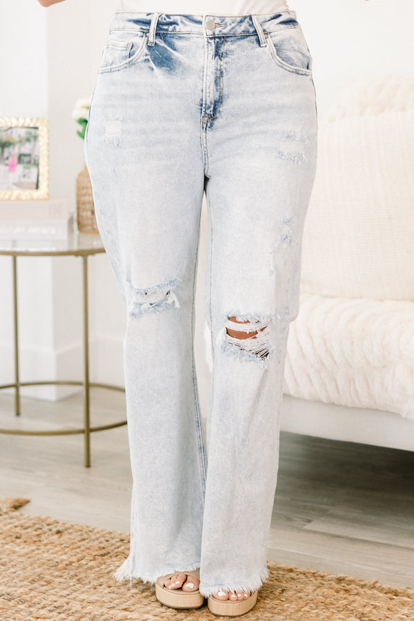 Chic Soul plus size clothing, light wash blue denim jeans with rips at the knees and frayed edges