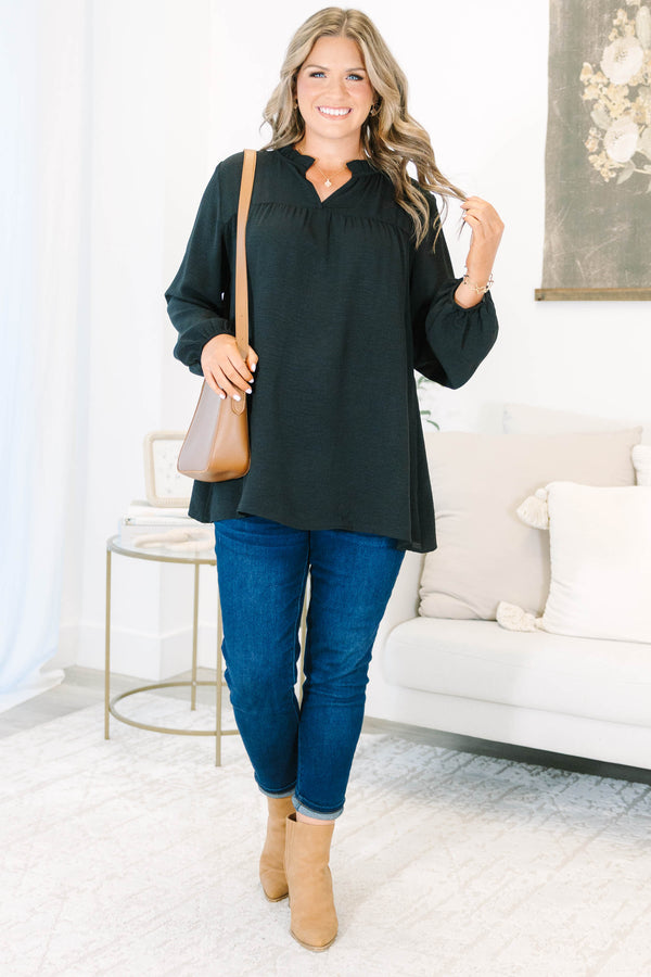 Plus Size black long sleeve top with a ruffled split neckline and a relaxed, flowy fit.