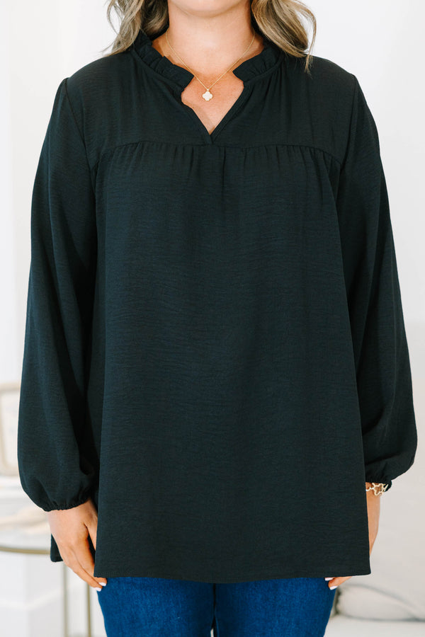 Plus Size black long sleeve top with a ruffled split neckline and a relaxed, flowy fit.